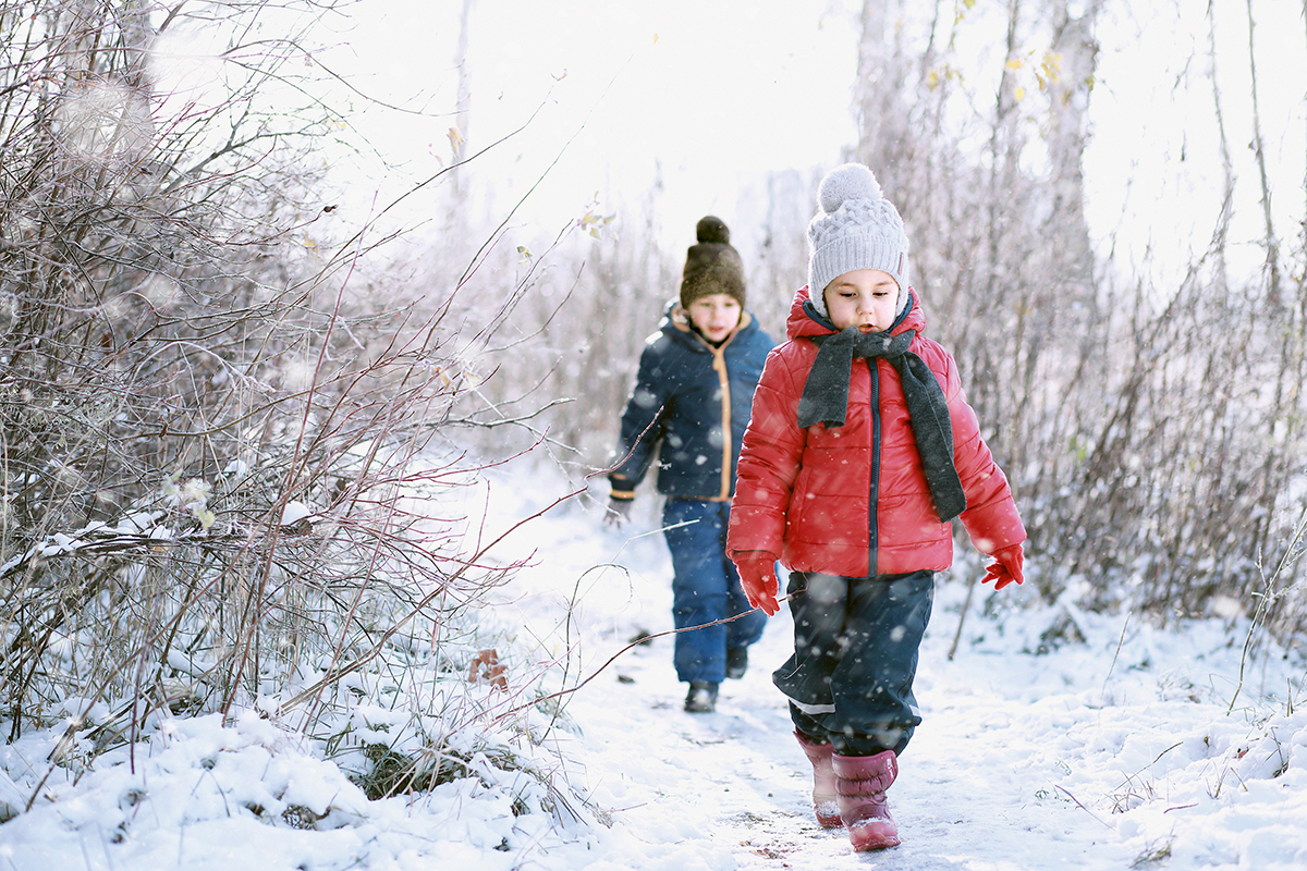 Kids walk in the park with first snow